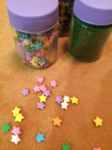 Cake sprinkle or confetti add color to a tablecloth.