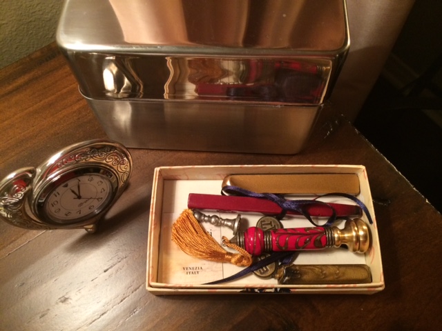 Writing seal, desk clock, and metal box for notecards.
