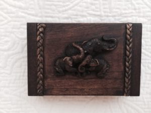 A fun business card box from Thailand with carved elephants on top.