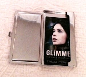 A silver business card holder that slides into your purse and also has a mirror to check your smile before handing out a card.